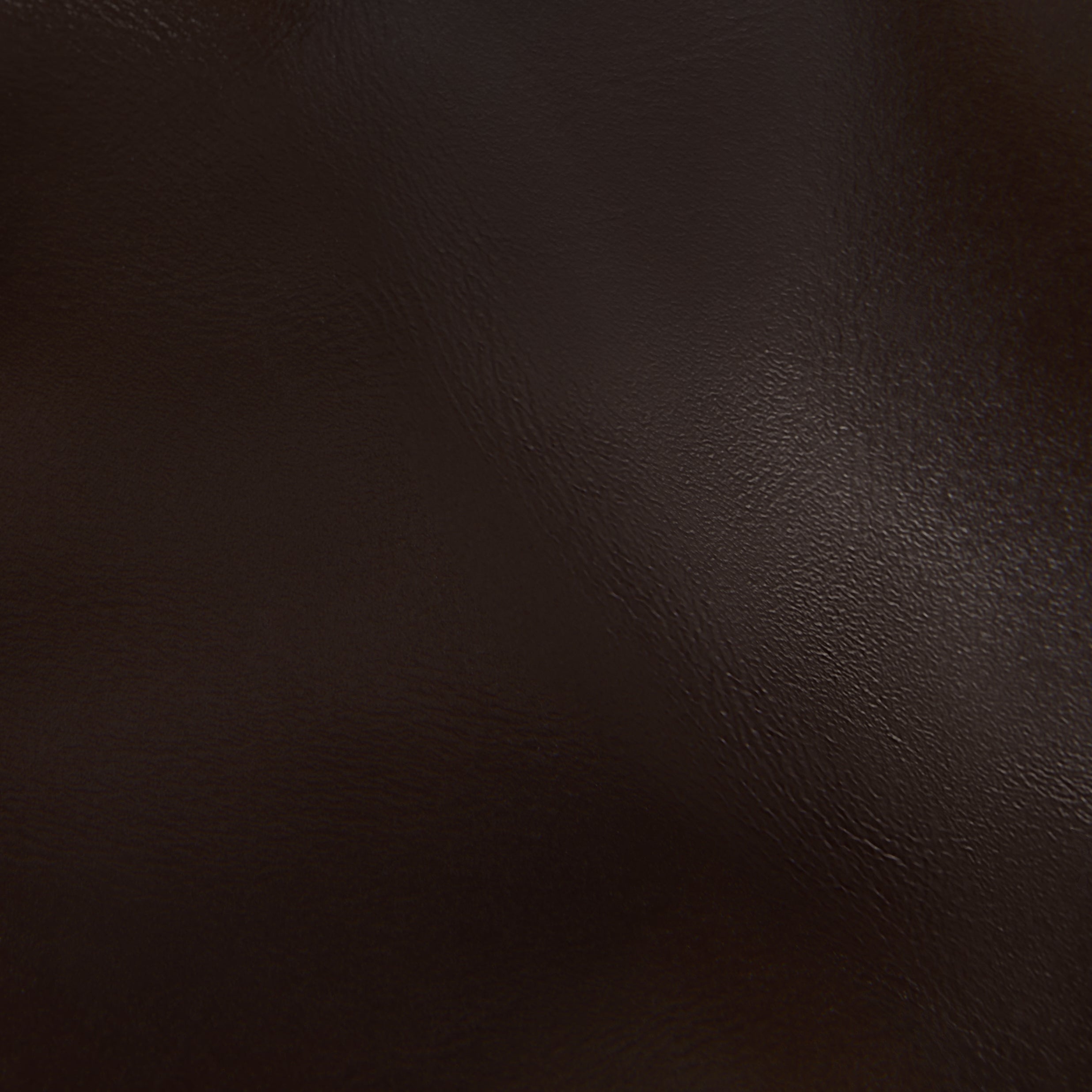 Close-up of dark brown leather texture