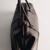 Chocolate Club Large Handbag on a light gray background