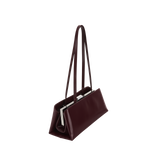 Burgundy Clutch Shoulder Handbag with a strap on a white background