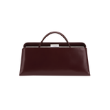 Burgundy Clutch Shoulder Handbag with a handle on a white background