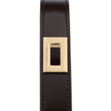 Black leather belt with a gold buckle on a white background