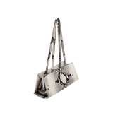 Python Éclair Clutch Shoulder Handbag with black snake print on a white background