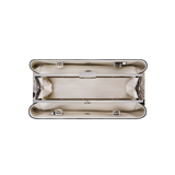 Python Éclair Clutch Shoulder Handbag  with decorative interior on a white background