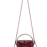 Maroon Python Café Mini Bag: Crossbody Handbag with a strap on a white background