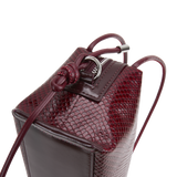 Maroon Python Café Mini Bag: Crossbody Handbag with a strap on a white background
