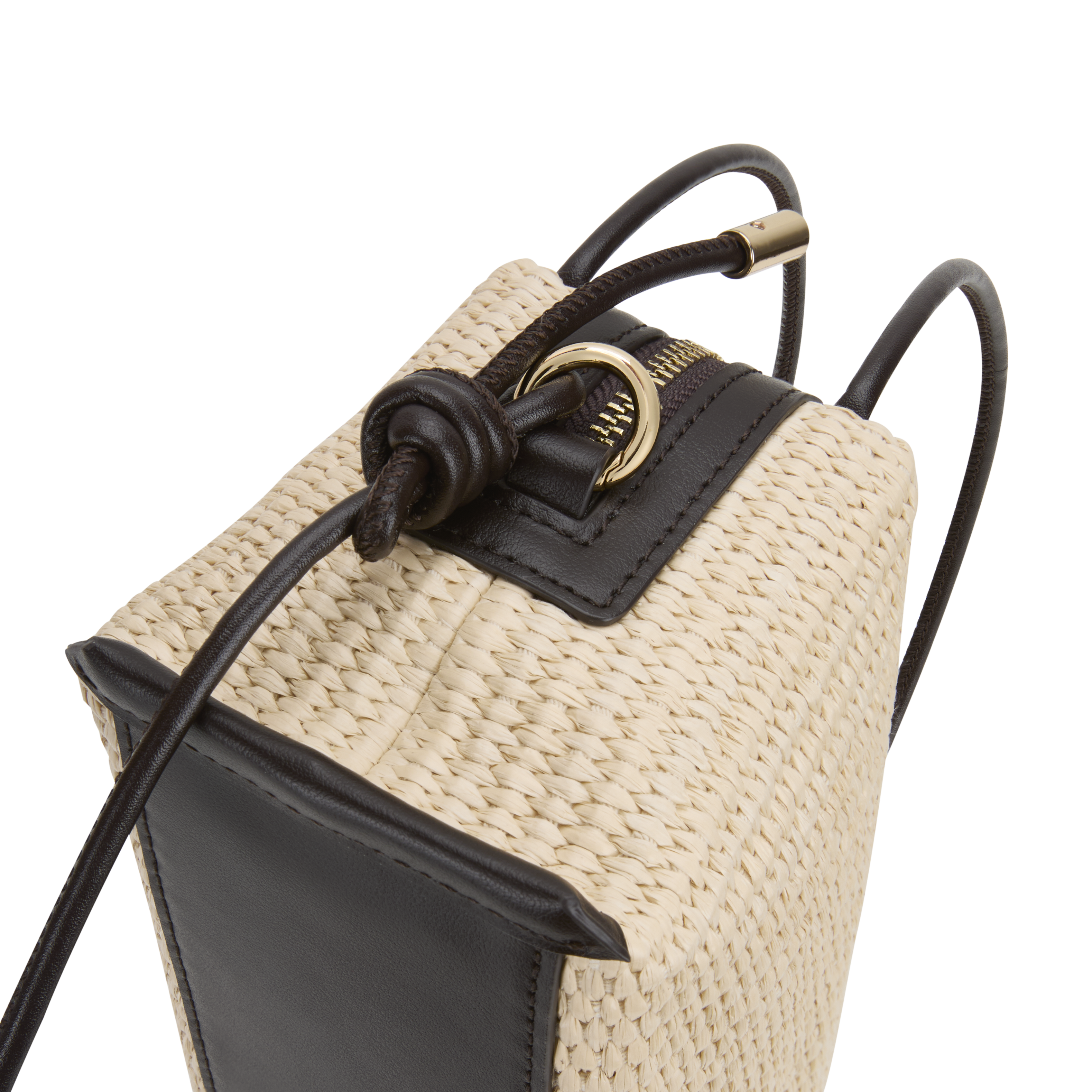 Close-up of a Raffia Café Mini Crossbody Handbag with black accents on a white background