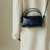 Verafied New York Black Lizard Café Mini Handbag worn over shoulder against a neutral background