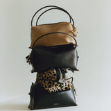 A group of mini crossbody handbags