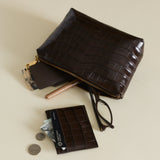 Mocha Croc Makeup Pouch and cardholder on a beige background